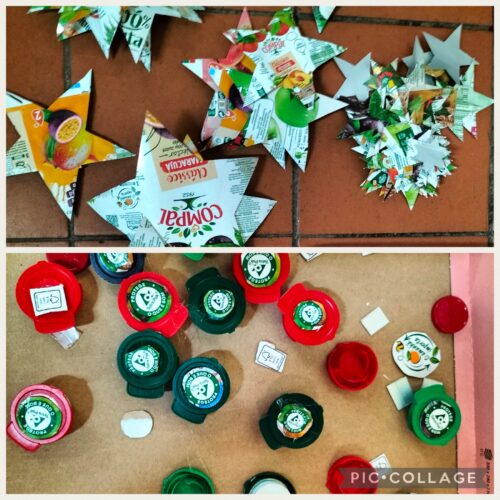 Estrelas e adornos da árvore, construídos com embalagens da Compal, onde são visíveis os símbolos da Tetra Pak e da Compal.