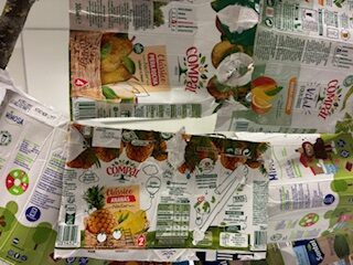 Símbolos Compal e Tetra Pak