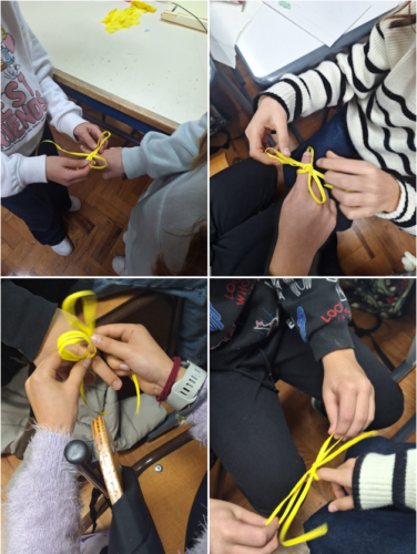 Alunos a aprender / treinar a fazer laços.