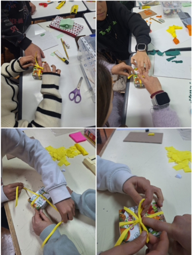 Alunos a dar laços em pacotes da Compal.