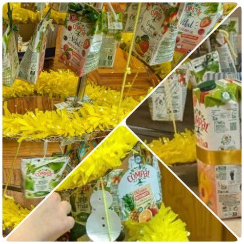 Símbolos tetra pak e compal<br/>O destaque da decoração da árvore foi para as embalagens tetra pack da compal, que preencheram todo o espaço. As numerosas peças de decoração foram atadas ao suporte, destacando o facto de serem pacotes reutilizados.