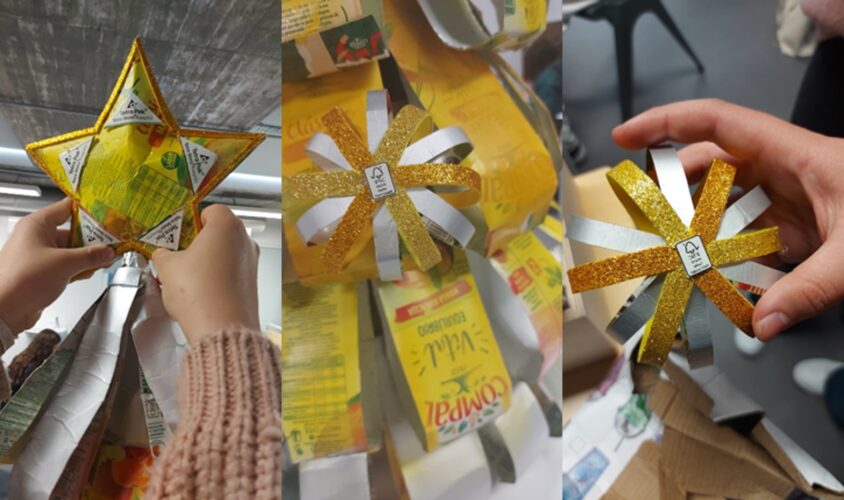 Símbolo Tetra Pak visível na estrela da árvore; Revestimento com tiras das embalagem Compal, onde é visivel a marca;Bolas construidas com tiras finas das embalagens da compal e papel EVA dourado, decoradas com o símbolo FSC no centro.