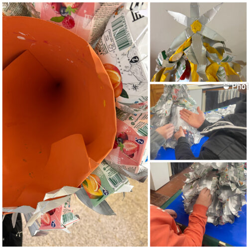 Visualização do cone de cartolina que é a estrutura onde a árvore vai ser construída. Colagem das Tetra Pak com cola quente. Pormenor da estrela no topo da árvore.