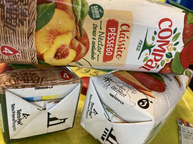 Símbolo do Compal e do Tetra Pak